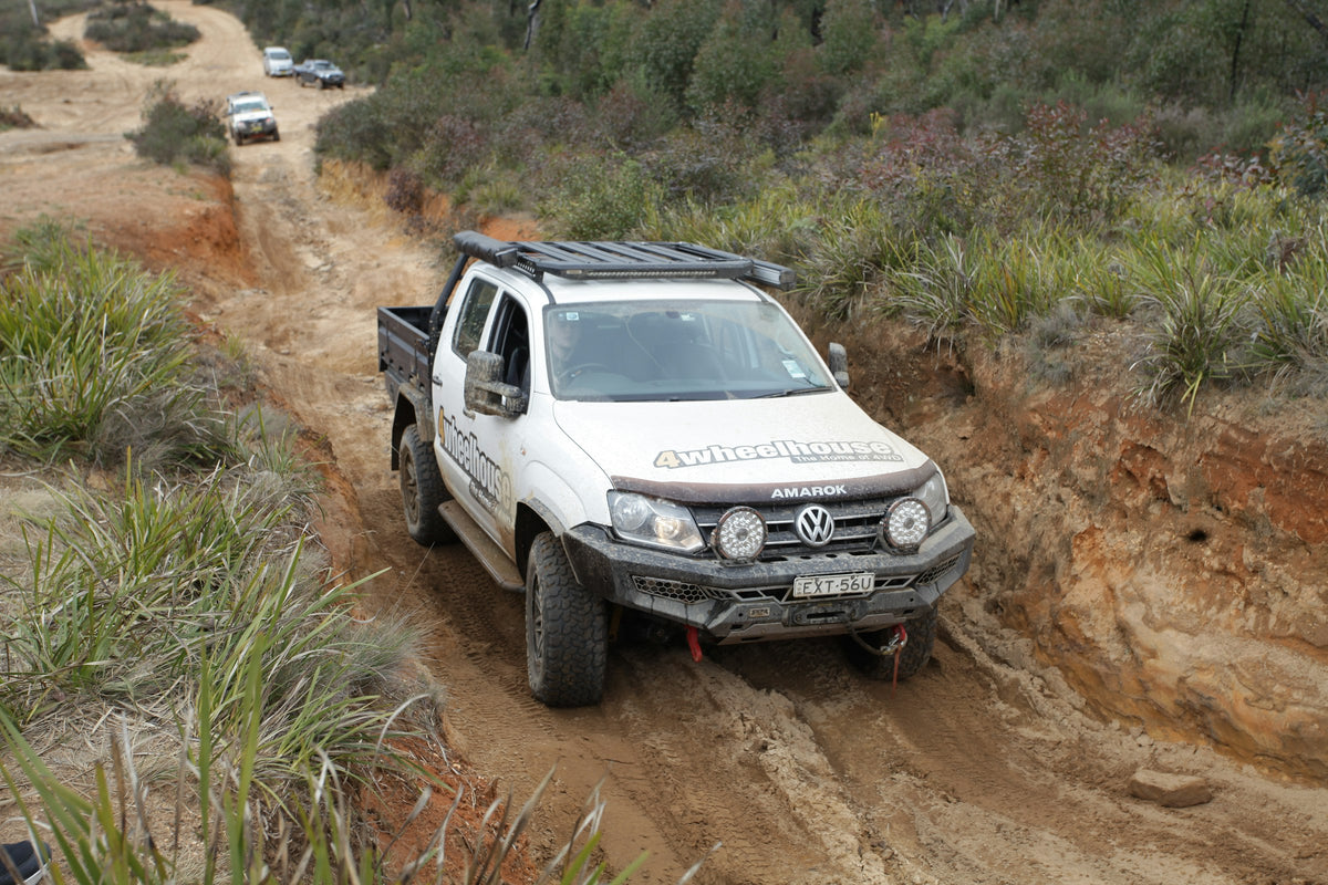 Ute on a narrow sandy track through Australian bushland